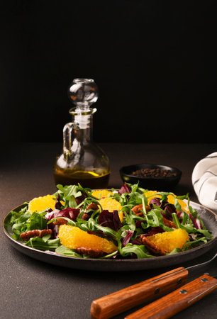 Arugula, orange and pecan salad. Radicchio salad on brown backgroundの写真素材