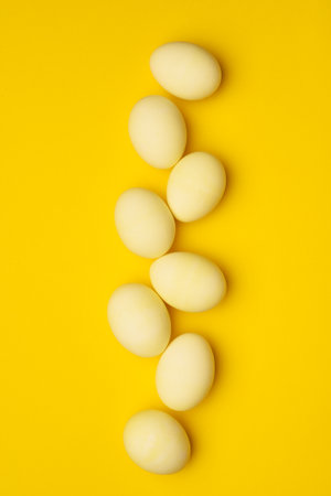 Yellow eggs on a yellow background. Easter holidayの写真素材