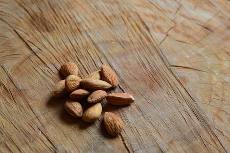 almonds on a wooden tablの写真素材