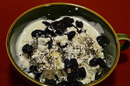 cottage cheese and sour cream with dried fruits and sesame seedsの写真素材