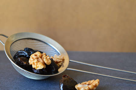 dried fruits and nuts in the gridの写真素材