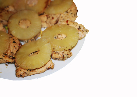 Tasty baked chicken cooked with ripe pineapple.の写真素材