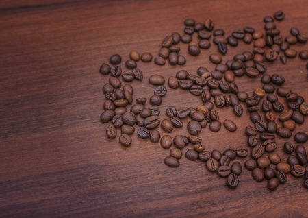 Beautiful coffee beans, Fried coffee beans on a chocolate board.の写真素材