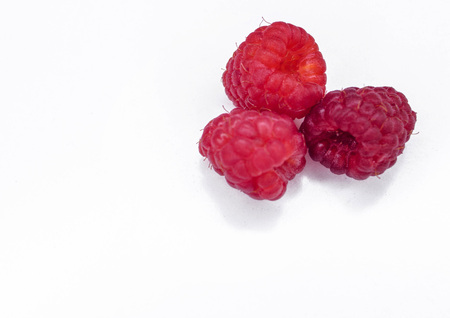 Ripe raspberries on white background. Useful berries for jam.の写真素材