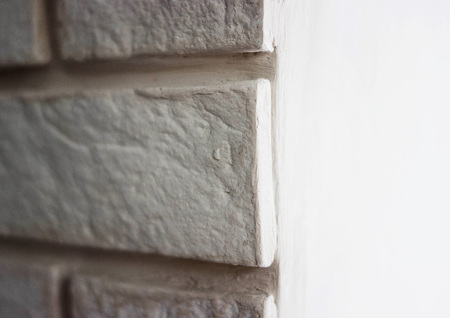 Gypsum white tile on the wall with masonryの写真素材