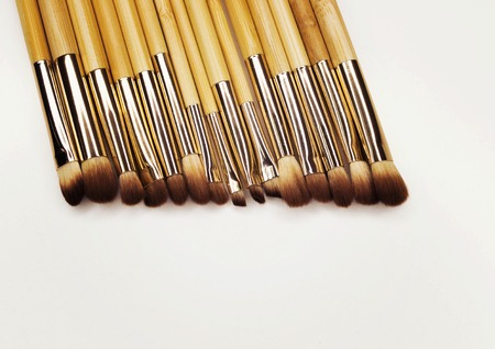Eye makeup brushes with bamboo handles on a white background