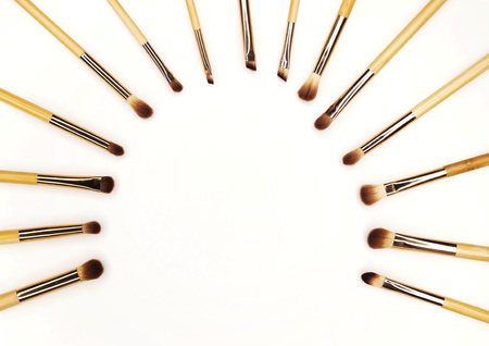 Eye makeup brushes with bamboo handles on a white backgroundの写真素材