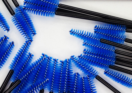 Many scattered eyeliner brushes on a white backgroundの写真素材