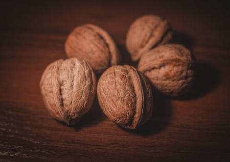 Walnuts. Nuts on a dark wooden background. Very useful fruits for the brain.の写真素材
