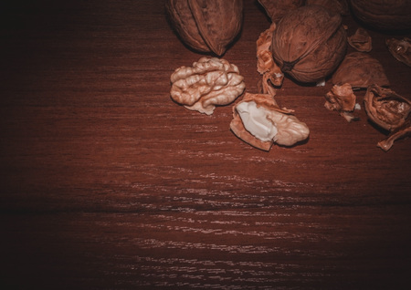 Walnuts. Nuts on a dark wooden background. Very useful fruits for the brain.の写真素材