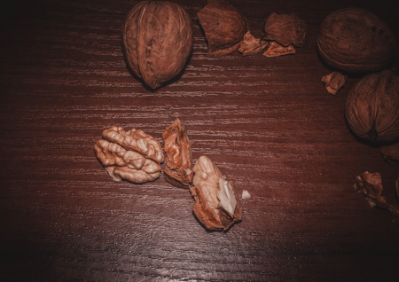 Walnuts. Nuts on a dark wooden background. Very useful fruits for the brain.の写真素材