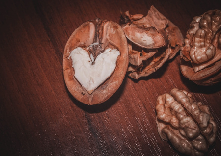 Walnuts. Nuts on a dark wooden background. Very useful fruits for the brain.の写真素材