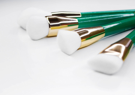 Makeup artist tools. Brushes for make-up from natural white nap in a beautiful frame.の写真素材