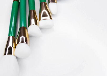 Makeup artist tools. Brushes for make-up from natural white nap in a beautiful frame.