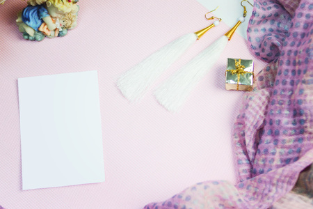 Sticker on pink near flowers and women's cosmetics accessories and jewelryの写真素材