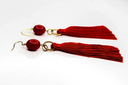 Very beautiful red sergi on a white background, Female decoration for a party.の写真素材