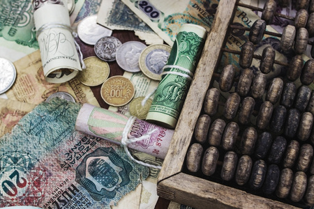 Ancient money of different denominations on a tree near accountsの写真素材