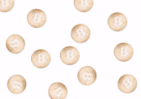 Pile of golden bitcoin currency tokens isolated over the white backgroundの写真素材