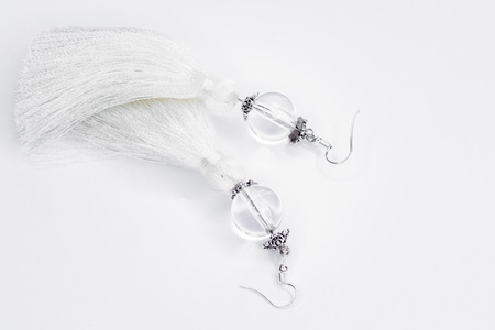 Sergi-tassels made of silk thread and jewelry on a white background. Handmade.の写真素材