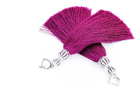 Sergi-tassels made of silk thread and jewelry on a white background. Handmade.の写真素材