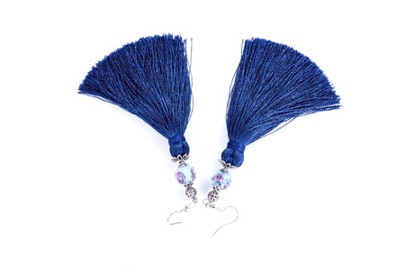 Sergi-tassels made of silk thread and jewelry on a white background. Handmade.の写真素材