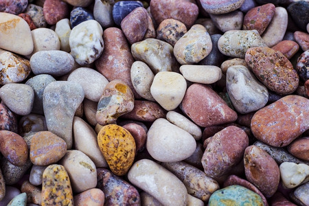 Many sea stones of different color and size. Smooth stone. Pebbles.の写真素材