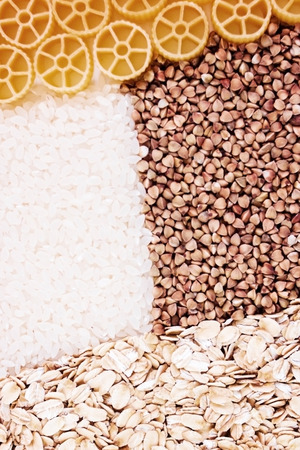 Dry foods of healthy nutrition, seeds of healthy foods, rice, buckwheat, pasta, pasta, dried products, background or textureの写真素材