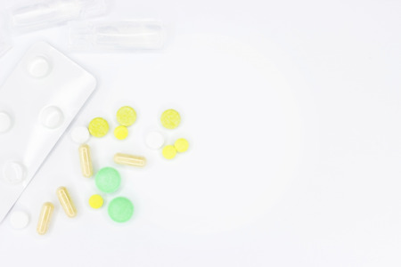 Pills for treatment. Pills on a white background for the announcement. Place for text on medetsine....
