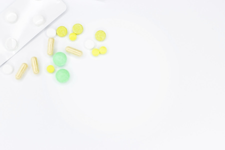 Pills for treatment. Pills on a white background for the announcement. Place for text on medetsine. Background or texture. Fasting on the Internet.の写真素材