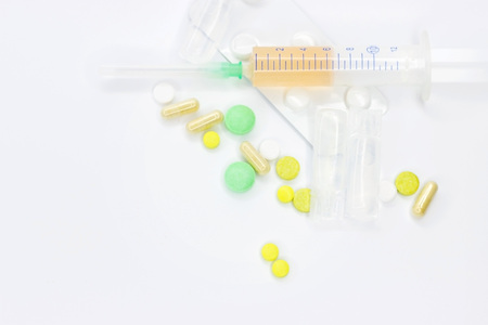 Group of pink medical pills isolated on white background