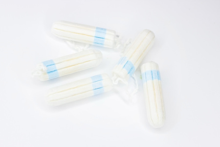 What you choose: a tampon or menstrual cup. White vintage background. Selective focus, day light.の写真素材