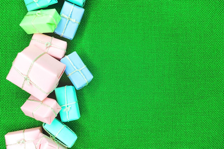 Bright boxes with gifts on a green background close-upの写真素材