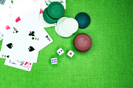 poker chips dice four aces on a green backgroundの写真素材