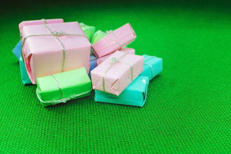 Festive background with gifts on green texture