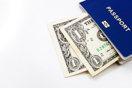Passport with dollars on a white backgroundの写真素材