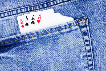 Playing cards for poker in jeans pocket