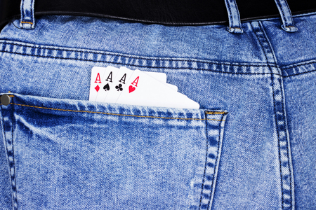 Playing cards for poker in jeans pocketの写真素材