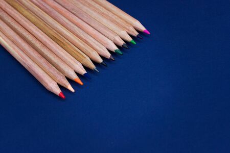 Pencils on a blue background, stationery theme.
