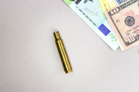 Ammunition shells and money, fonil texture for arms trade