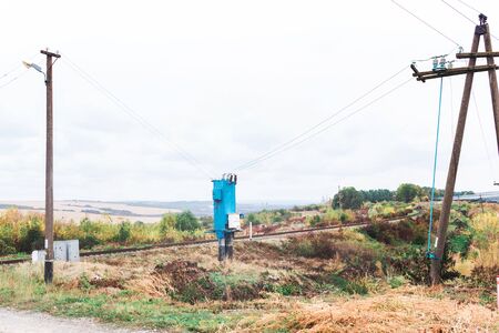 Old electric transformer near the railway