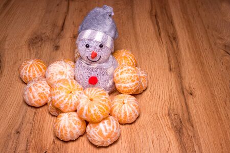 Snowman near the christmas treeの写真素材