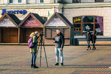 Ternopil, Ukraine - November 16, 2019 Journalist makes a report