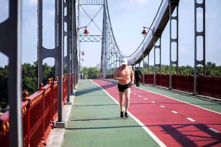 Kiev UKRAINE. August 13 2021. Pedestrian bridge over the Dnieper river in the city of Kievのeditorial素材