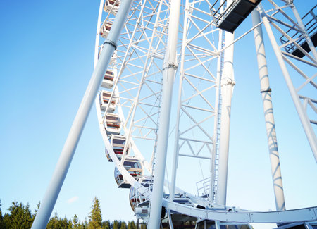 Ferries wheel on the sky. White viewing circle on a blue sky backgroundの写真素材