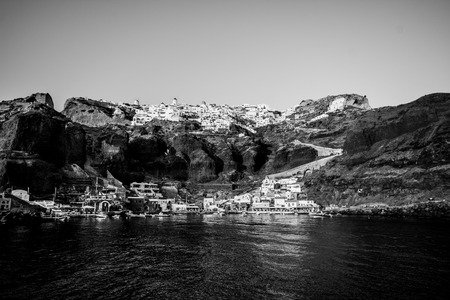The town of Oia with the harbor and houses in black and white.の写真素材