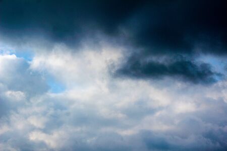 Winter blue sky with clouds over the horizon.の写真素材