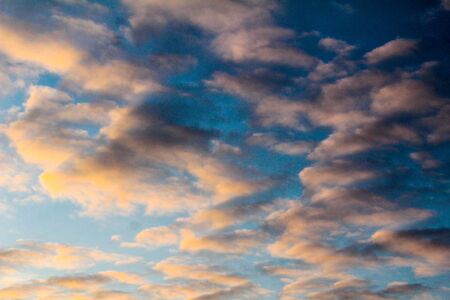 Star named sun at sunset day dark sky gray cloudsの写真素材