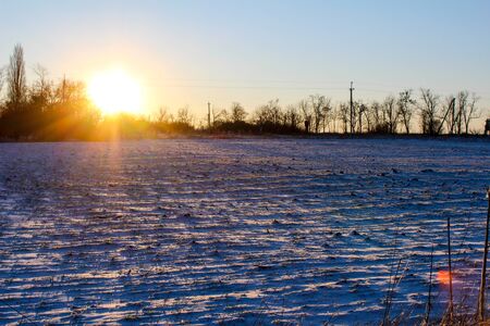 winter landscape with river and trees sunset over lake house on the lake forest in winter abstract background winter landscape with river and treesの写真素材