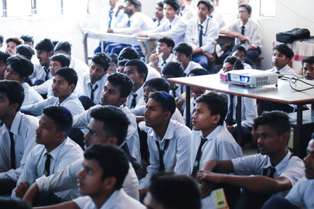 A group of students attending a lecture in the classroom. Education concept.の写真素材