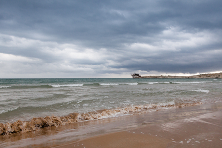 Gargano sandy beach in South Italy at stormの写真素材